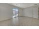 Bright bedroom with tile flooring, backyard access, and neutral finishes at 370 Mano Destra Ln, Henderson, NV 89011