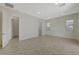 Bright bedroom with ceramic tile flooring, recessed lights, and a view of the backyard at 370 Mano Destra Ln, Henderson, NV 89011