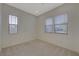 Bright bedroom with carpet and large windows offering natural light and comfortable living space at 370 Mano Destra Ln, Henderson, NV 89011