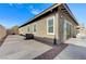 Exterior view of the home highlighting the stucco siding and concrete patio at 370 Mano Destra Ln, Henderson, NV 89011