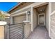 Charming home featuring stone accents, a cozy front patio, a two-car garage, and a desert landscape at 370 Mano Destra Ln, Henderson, NV 89011