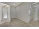 Hallway with tile flooring and neutral paint leads to other rooms in the home at 370 Mano Destra Ln, Henderson, NV 89011
