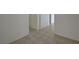 A bright hallway featuring tile flooring and neutral walls that enhance the sense of space at 370 Mano Destra Ln, Henderson, NV 89011