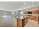 Open-concept kitchen featuring an island with granite counters and stainless steel appliances at 370 Mano Destra Ln, Henderson, NV 89011
