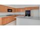 Well-equipped kitchen featuring granite counters, stainless steel appliances and gas cooktop at 370 Mano Destra Ln, Henderson, NV 89011