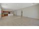 Open-concept living room featuring tile flooring and a seamless flow into the kitchen at 370 Mano Destra Ln, Henderson, NV 89011