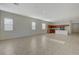 Bright living room with tile floors and large windows, seamlessly connected to the kitchen at 370 Mano Destra Ln, Henderson, NV 89011