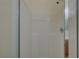 Shower featuring tiled walls, showerhead, and glass door at 370 Mano Destra Ln, Henderson, NV 89011