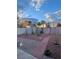 Fenced backyard showcasing a storage shed, a pathway, and simple landscaping at 3748 E Hacienda Ave, Las Vegas, NV 89120