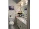 Cozy bathroom with a single vanity, marble countertop, and framed mirror at 3748 E Hacienda Ave, Las Vegas, NV 89120