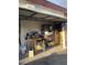 Open garage view showing storage and items, with visible concrete floor at 3748 E Hacienda Ave, Las Vegas, NV 89120