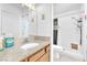 Bright bathroom featuring a shower and neutral cabinets with a light countertop at 4153 Broadriver Dr, Las Vegas, NV 89108