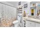 Bright bathroom with decorative shower curtain and neutral vanity with light countertop at 4153 Broadriver Dr, Las Vegas, NV 89108