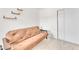 Cozy bedroom features neutral walls, a futon couch, and sleek, modern floors at 4153 Broadriver Dr, Las Vegas, NV 89108
