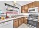 Well-lit kitchen with modern appliances, granite countertops, and ample cabinet space at 4153 Broadriver Dr, Las Vegas, NV 89108