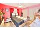 Bright bedroom featuring pink walls, wood floors, and a Paris-themed duvet cover at 4735 Monterrey Ave, Las Vegas, NV 89121