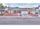 Single-story home with well-maintained yard, two-car garage, and mature landscaping at 4735 Monterrey Ave, Las Vegas, NV 89121