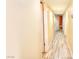 Hallway with tile floors and cream-colored walls, leading to other rooms in the home at 4735 Monterrey Ave, Las Vegas, NV 89121