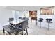 Modern kitchen with wood floors, granite countertops, and stainless steel appliances is open to the dining area at 4735 Monterrey Ave, Las Vegas, NV 89121