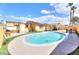 Backyard pool with solar panels and an outdoor kitchen area perfect for entertaining at 4735 Monterrey Ave, Las Vegas, NV 89121