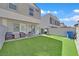 A fenced backyard showcasing a plush lawn area with furnishings creating an outdoor living space at 4932 Chidlaw Ave # 2, Las Vegas, NV 89115