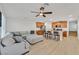 Spacious living room seamlessly connected to a modern kitchen, featuring a large sectional and breakfast bar at 4932 Chidlaw Ave # 2, Las Vegas, NV 89115