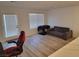 Bright living room with wood-look floors and a sliding glass door at 4932 Chidlaw Ave # 2, Las Vegas, NV 89115