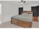 A primary bedroom featuring a ceiling fan and dark curtains and wood dresser at 4932 Chidlaw Ave # 2, Las Vegas, NV 89115