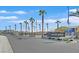 Welcoming entrance to Falcon Ridge, featuring palm trees, a sign, and attractive landscaping at 4932 Chidlaw Ave # 2, Las Vegas, NV 89115