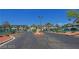 Apartment community entrance featuring a gated entry, well-maintained landscaping, and inviting residential buildings at 5151 Lindell Rd # 103, Las Vegas, NV 89118