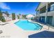 Community pool featuring clear blue water, a spacious deck, and a great spot for relaxation and recreation at 5151 Lindell Rd # 103, Las Vegas, NV 89118