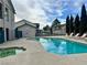 Community pool area featuring a refreshing pool, relaxing lounge chairs, and well-maintained landscaping for residents at 5151 Lindell Rd # 103, Las Vegas, NV 89118