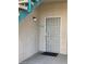 A secure ground floor unit entrance with a security screen door and a welcoming entrance mat at 5151 Lindell Rd # 103, Las Vegas, NV 89118