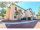 Exterior shot of a two-story condo featuring balconies and well-maintained landscaping creating an inviting atmosphere at 5151 Lindell Rd # 103, Las Vegas, NV 89118