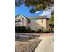 A well-maintained two-story condo building with desert-friendly landscaping and convenient parking at 5151 Lindell Rd # 103, Las Vegas, NV 89118