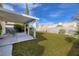Expansive backyard features a covered patio, lush lawn, and privacy fence at 5224 Jose Ernesto St, North Las Vegas, NV 89031