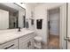 Modern bathroom featuring stylish vanity with stone countertop, and step-in shower and walk-in closet at 5224 Jose Ernesto St, North Las Vegas, NV 89031