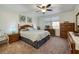 Cozy bedroom boasts a ceiling fan, ample natural light, and traditional furnishings at 5224 Jose Ernesto St, North Las Vegas, NV 89031