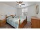 This bedroom offers natural light and is complimented by traditional wood furnishings at 5224 Jose Ernesto St, North Las Vegas, NV 89031