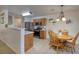 Cozy dining area with a wooden table set and a partial view of the kitchen appliances at 5224 Jose Ernesto St, North Las Vegas, NV 89031