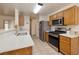 Modern kitchen features a breakfast bar, stainless steel appliances, and lots of counter space at 5224 Jose Ernesto St, North Las Vegas, NV 89031