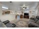 Open-concept living area boasts tile floors, a ceiling fan, and a view of the adjacent kitchen at 5224 Jose Ernesto St, North Las Vegas, NV 89031