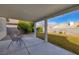 This backyard features a covered patio and lawn, perfect for enjoying the outdoors at 5224 Jose Ernesto St, North Las Vegas, NV 89031