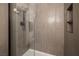 Modern walk-in shower with sleek fixtures and integrated shelving at 5224 Jose Ernesto St, North Las Vegas, NV 89031