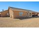 The home features a spacious backyard with gravel landscaping and privacy at 5450 Barnwood Ct, Pahrump, NV 89061