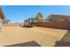 This gravel backyard has ample parking with a view of mountains in the distance at 5450 Barnwood Ct, Pahrump, NV 89061