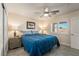 Comfortable bedroom featuring a ceiling fan, large window, and stylish furniture for a relaxing atmosphere at 5450 Barnwood Ct, Pahrump, NV 89061