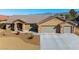 Charming single-story home with a three-car garage and a spacious driveway at 5450 Barnwood Ct, Pahrump, NV 89061