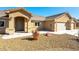 Inviting single-story home with a covered entrance and low-maintenance desert landscaping at 5450 Barnwood Ct, Pahrump, NV 89061