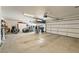 Spacious two-car garage with storage, including a motorcycle and car at 5450 Barnwood Ct, Pahrump, NV 89061